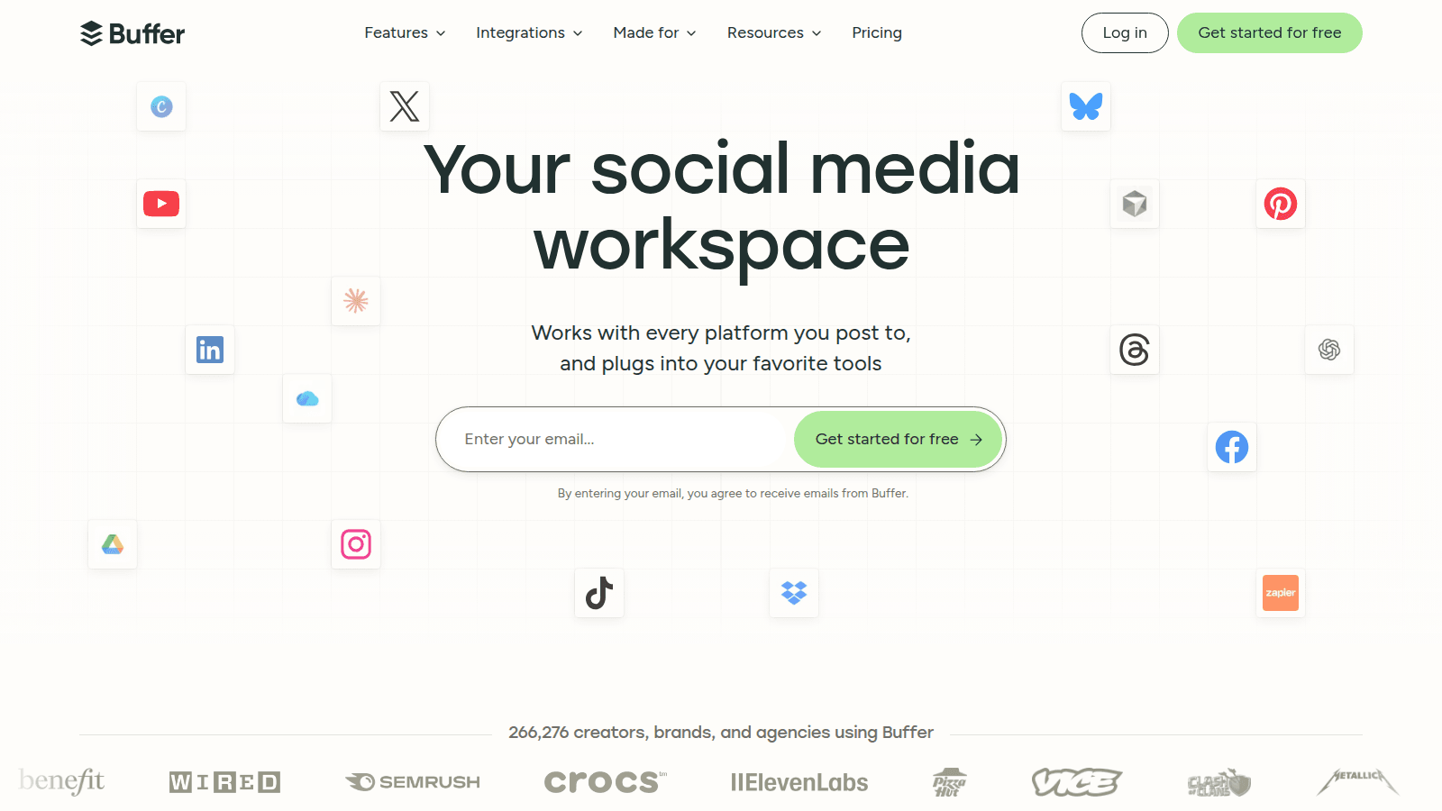 Buffer social calendar — official buffer.com homepage hero with Your social media workspace and platform icons around an email signup
